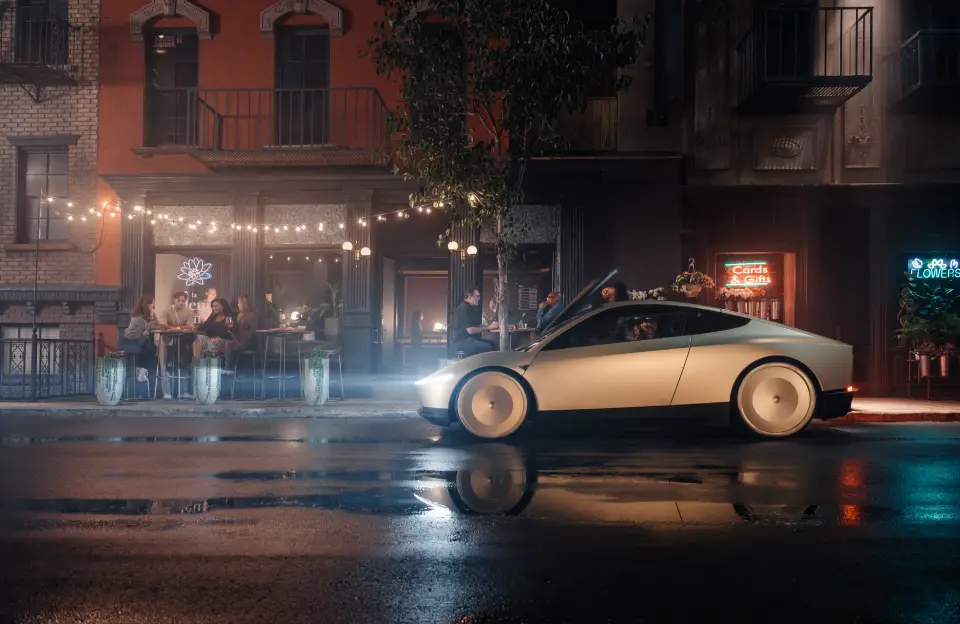 Tesla robotaxi w tle restauracja.